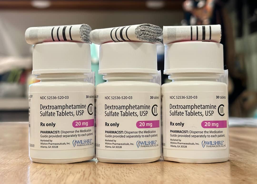 Dexamphetamine medication in sealed pharmacy containers labelled with dosage strength in milligrams and the quantity of tablets inside. Dexamphetamine For Sale Australia