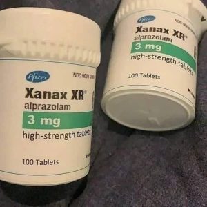 Alprazolam Xanax medication containers labelled with dosage information in milligrams, neatly arranged on a clean white surface under bright lighting, commonly prescribed for anxiety and panic disorders. Xanax For Sale in Australia